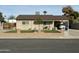 Charming home with manicured lawn, carport, and inviting curb appeal at 538 E Glade Ave, Mesa, AZ 85204