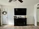 Comfortable living area with tile floors, a fireplace, and a large TV at 538 E Glade Ave, Mesa, AZ 85204