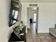 Bright living room featuring a large TV, tile floors, and open doorway at 538 E Glade Ave, Mesa, AZ 85204
