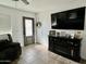 Cozy living area with tile floors, fireplace, large TV, and ample natural light at 538 E Glade Ave, Mesa, AZ 85204