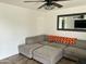 Comfortable living room with a large sectional sofa and stylish decor at 538 E Glade Ave, Mesa, AZ 85204