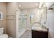 Bathroom featuring a double sink vanity and a glass-enclosed shower with a view at 6145 E Cave Creek Rd # 203, Cave Creek, AZ 85331