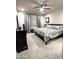 Bedroom featuring a ceiling fan, carpet floors, a bed, and grey curtains on the window at 6145 E Cave Creek Rd # 203, Cave Creek, AZ 85331