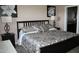 This bedroom features a queen size bed with modern decor and furnishings and adjoining bathroom at 6145 E Cave Creek Rd # 203, Cave Creek, AZ 85331