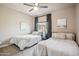 Cozy bedroom featuring two twin beds, ceiling fan and view from window at 6145 E Cave Creek Rd # 203, Cave Creek, AZ 85331