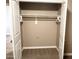 A spacious closet features neutral walls, carpet, and a wooden hanging rod at 6145 E Cave Creek Rd # 203, Cave Creek, AZ 85331