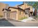Beautiful home exterior showcasing stone accents, a two-car garage, and well-maintained landscaping at 6145 E Cave Creek Rd # 203, Cave Creek, AZ 85331