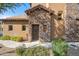Charming front door with stone accents and manicured landscaping creating a welcoming entrance at 6145 E Cave Creek Rd # 203, Cave Creek, AZ 85331