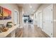 Elegant hallway leading to a dining area and living spaces with decorative elements and natural light at 6145 E Cave Creek Rd # 203, Cave Creek, AZ 85331