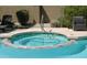 Hot tub with seating and views of the pool at 6145 E Cave Creek Rd # 203, Cave Creek, AZ 85331