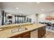Open kitchen overlooking living and dining areas, featuring granite counters and stainless appliances at 6145 E Cave Creek Rd # 203, Cave Creek, AZ 85331