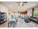 Open concept living area with modern furnishings, wood-look flooring, and seamless flow to kitchen at 6145 E Cave Creek Rd # 203, Cave Creek, AZ 85331