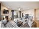 Inviting living room with a cozy fireplace, plush seating, and access to an outdoor patio at 6145 E Cave Creek Rd # 203, Cave Creek, AZ 85331