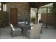 Shaded patio area with outdoor furniture, table, and nearby restrooms at 6145 E Cave Creek Rd # 203, Cave Creek, AZ 85331