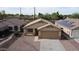 Aerial view of the home showcasing its roof, landscaping, and position in the neighborhood at 6410 W Winslow Ave, Phoenix, AZ 85043