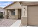 Home exterior featuring a covered porch and two-car garage, with clean lines at 6410 W Winslow Ave, Phoenix, AZ 85043