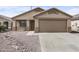 Charming single-story home with desert landscaping and a two-car garage, offering curb appeal at 6410 W Winslow Ave, Phoenix, AZ 85043