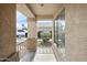 Covered front porch with decorative railing and a view of the surrounding neighborhood at 6410 W Winslow Ave, Phoenix, AZ 85043