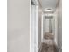 Hallway with carpeted floors and white doors leading to various rooms at 6410 W Winslow Ave, Phoenix, AZ 85043