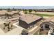 Aerial showing a house with a garage, landscaping, and easy access to neighborhood amenities at 6811 S Four Peaks Way, Chandler, AZ 85249