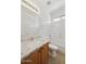 Clean bathroom with a granite vanity, sink, toilet, shower and tub combination; providing a serene and functional space at 6811 S Four Peaks Way, Chandler, AZ 85249