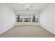 Spacious bedroom with neutral carpet and window offering natural light and serene neighborhood views at 6811 S Four Peaks Way, Chandler, AZ 85249