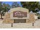 Stone community entrance sign with desert landscaping creates an attractive welcome for visitors and residents at 6811 S Four Peaks Way, Chandler, AZ 85249