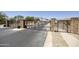 Gated community entrance featuring stone pillars, manicured landscaping, and secure access for residents' peace of mind at 6811 S Four Peaks Way, Chandler, AZ 85249