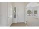 Bright entryway featuring neutral colors, carpet, and tile flooring, seamlessly connecting to the living spaces at 6811 S Four Peaks Way, Chandler, AZ 85249