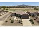 Expansive desert landscaping defines this home with a backyard view of a meticulously manicured golf course at 6811 S Four Peaks Way, Chandler, AZ 85249