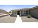 Inviting desert landscaping with charming front patio and walkway leading to the front door at 6811 S Four Peaks Way, Chandler, AZ 85249