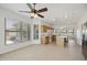 Open concept floor plan featuring the kitchen with traditional wood cabinets, granite counters, and stainless steel appliances at 6811 S Four Peaks Way, Chandler, AZ 85249