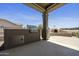 Outdoor kitchen featuring a built-in grill, storage, and a charming pizza oven for entertaining at 6811 S Four Peaks Way, Chandler, AZ 85249