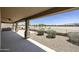 Covered patio includes BBQ, and fireplace with a view of the surrounding desert landscaping and community at 6811 S Four Peaks Way, Chandler, AZ 85249