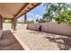 Backyard featuring gravel landscaping, brick walls, and a stainless steel barbecue grill at 6837 S Roosevelt St, Tempe, AZ 85283