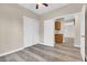 Comfortable bedroom featuring neutral walls, wood-style floors, and closet space at 6837 S Roosevelt St, Tempe, AZ 85283