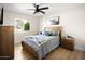 Comfortable bedroom with hardwood floors, natural light, and cozy decor offering a serene and inviting atmosphere at 7508 N 13Th Ave, Phoenix, AZ 85021