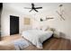 Bright, spacious bedroom features a modern ceiling fan, light hardwood floors, and a comfortable platform bed at 7508 N 13Th Ave, Phoenix, AZ 85021