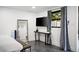 Modern bedroom featuring decor, mounted TV, and outdoor view at 7508 N 13Th Ave, Phoenix, AZ 85021