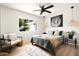 Comfortable bedroom featuring a ceiling fan, cozy textiles, and stylish decor for a relaxing and inviting atmosphere at 7508 N 13Th Ave, Phoenix, AZ 85021