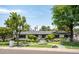 Charming single-story home with lush landscaping, mature trees, and a stone walkway leading to the entrance at 7508 N 13Th Ave, Phoenix, AZ 85021