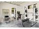 Home gym featuring workout equipment, arcade game and open doorway at 7508 N 13Th Ave, Phoenix, AZ 85021