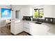 Contemporary kitchen with white cabinetry, stainless steel appliances, and modern fixtures at 7508 N 13Th Ave, Phoenix, AZ 85021