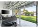 Open living room with a view of an outdoor pool and lounge area at 7508 N 13Th Ave, Phoenix, AZ 85021