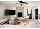 Cozy living room featuring a decorative fireplace, contemporary furnishings, and a large television at 7508 N 13Th Ave, Phoenix, AZ 85021