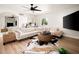 Comfortable living room with hardwood floors, modern decor, and a large sectional sofa at 7508 N 13Th Ave, Phoenix, AZ 85021