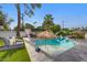 Lush backyard with a sparkling pool, lounge chairs, and an outdoor kitchen area at 7508 N 13Th Ave, Phoenix, AZ 85021