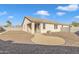 Spacious backyard with gravel landscaping, perfect for low-maintenance living and outdoor enjoyment at 7580 W Darrel Rd, Laveen, AZ 85339