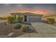 Inviting single-story home with a well-maintained landscape and neutral-toned facade at 7580 W Darrel Rd, Laveen, AZ 85339