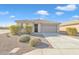 Charming single-story home boasting a well-kept yard and a welcoming facade at 7580 W Darrel Rd, Laveen, AZ 85339